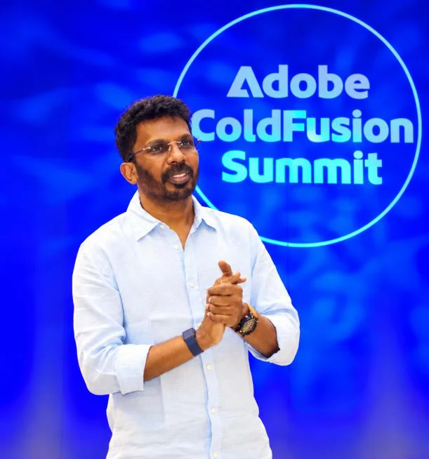 An Infoane engineer presenting on stage at the Adobe ColdFusion Summit