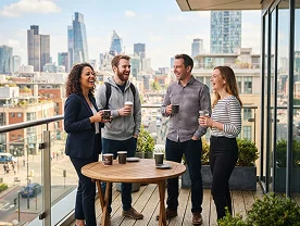 Colleagues having coffee on an office terrace